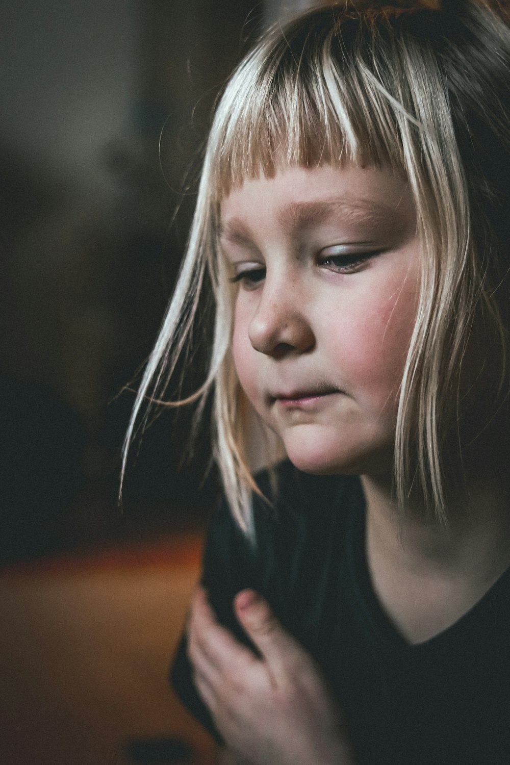 a little girl that is holding a cell phone