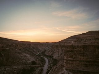 A breathtaking view of Barrancas del Cobre canyon at sunset with vibrant colors.