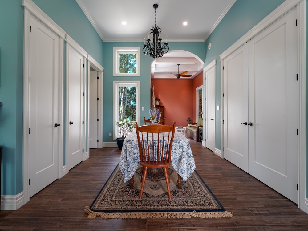 a dining room with a table and chairs