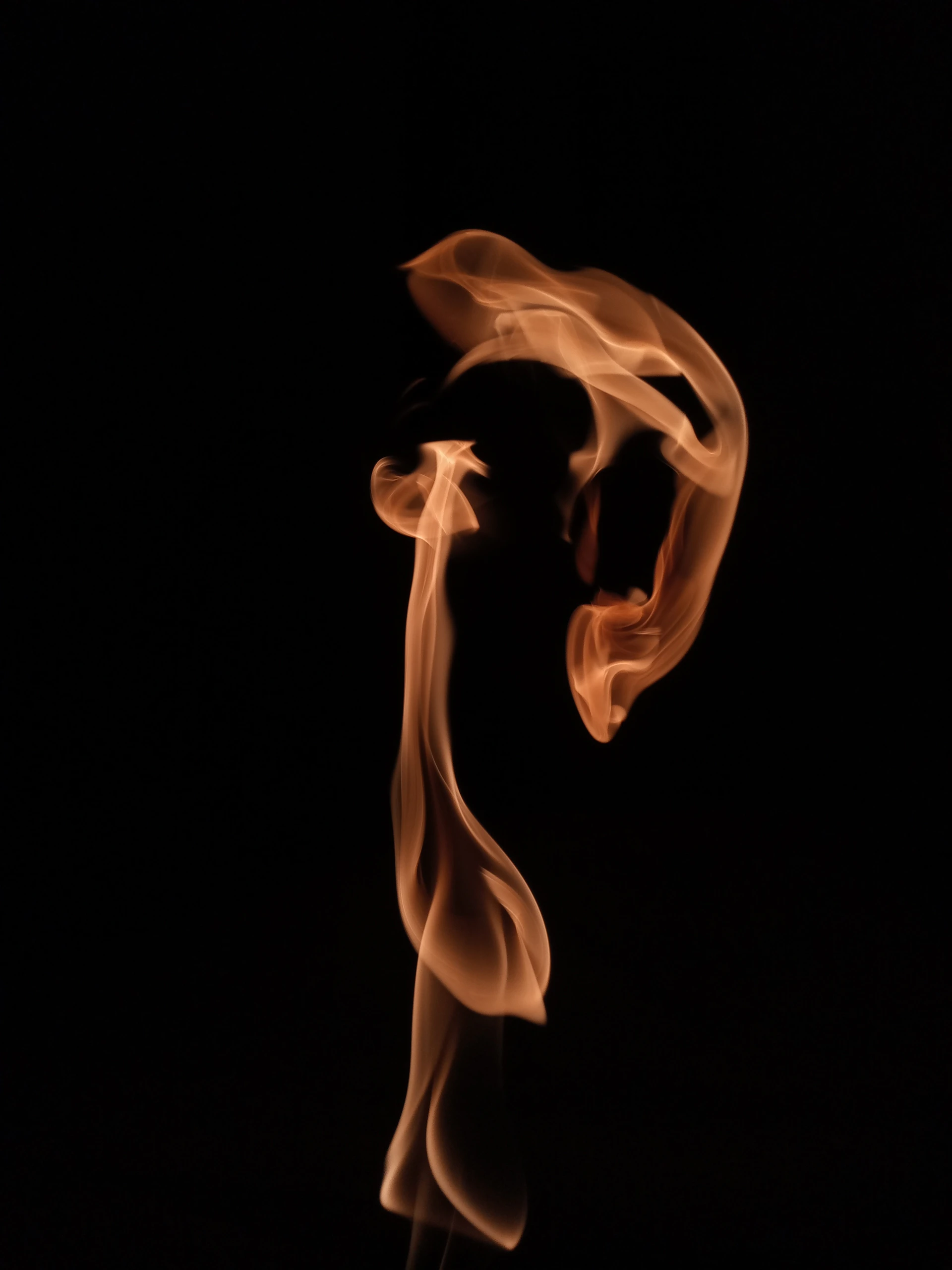 a close up of a fire on a black background