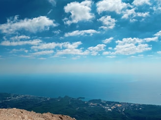 A panoramic view of the rugged northeastern Somalia coastline under a bright blue sky.