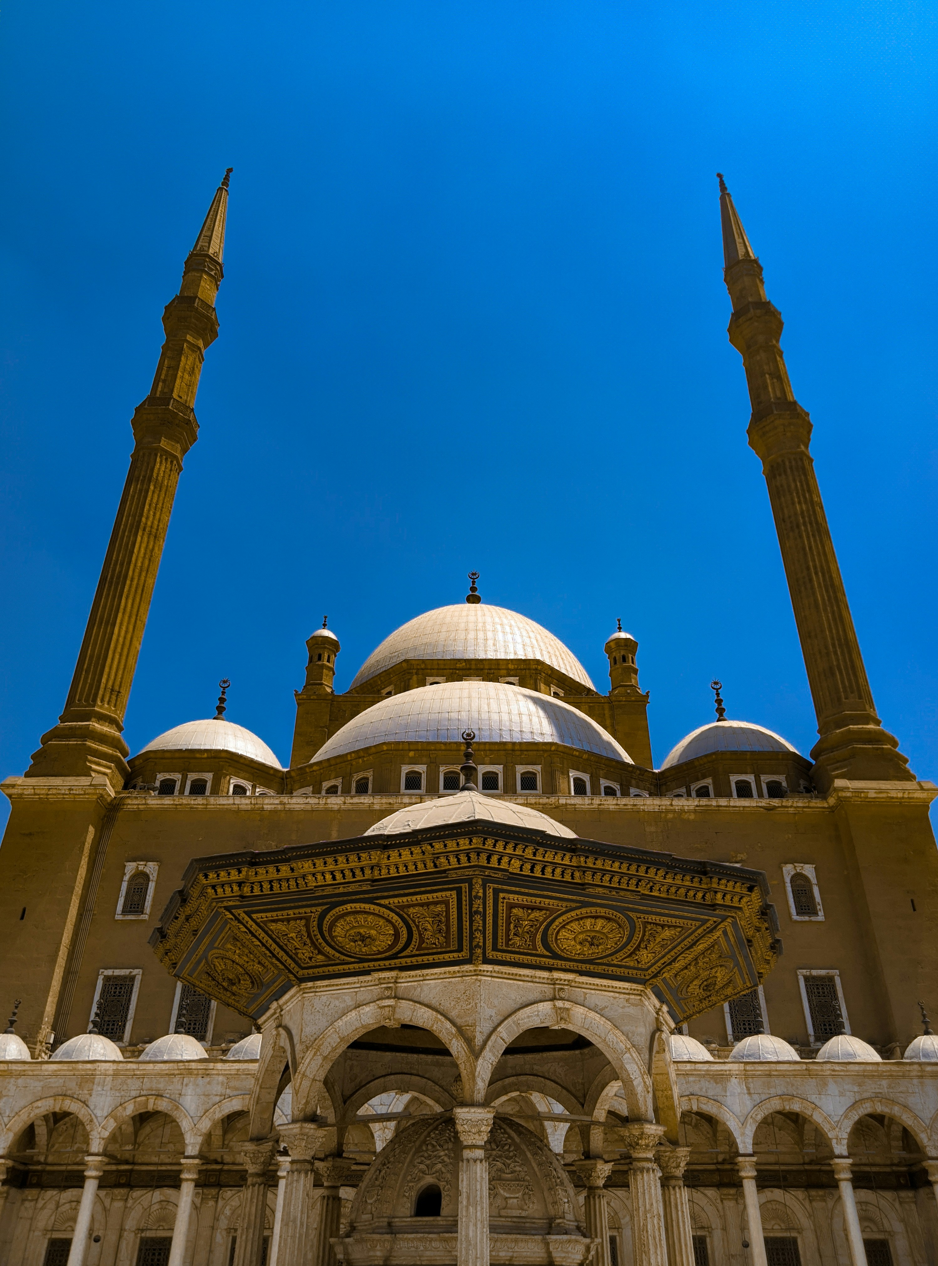 a large white building with two tall towers