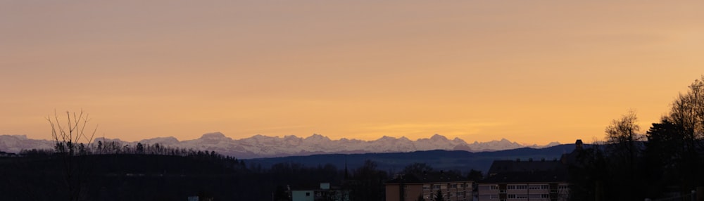 a view of a mountain range at sunset