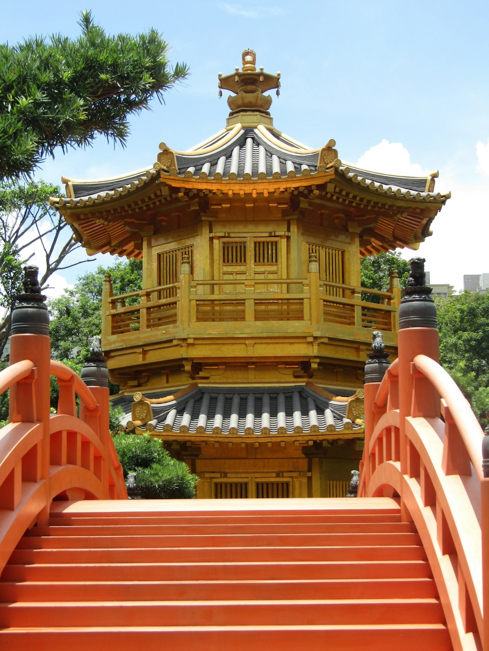 a tall building with a red staircase leading up to it