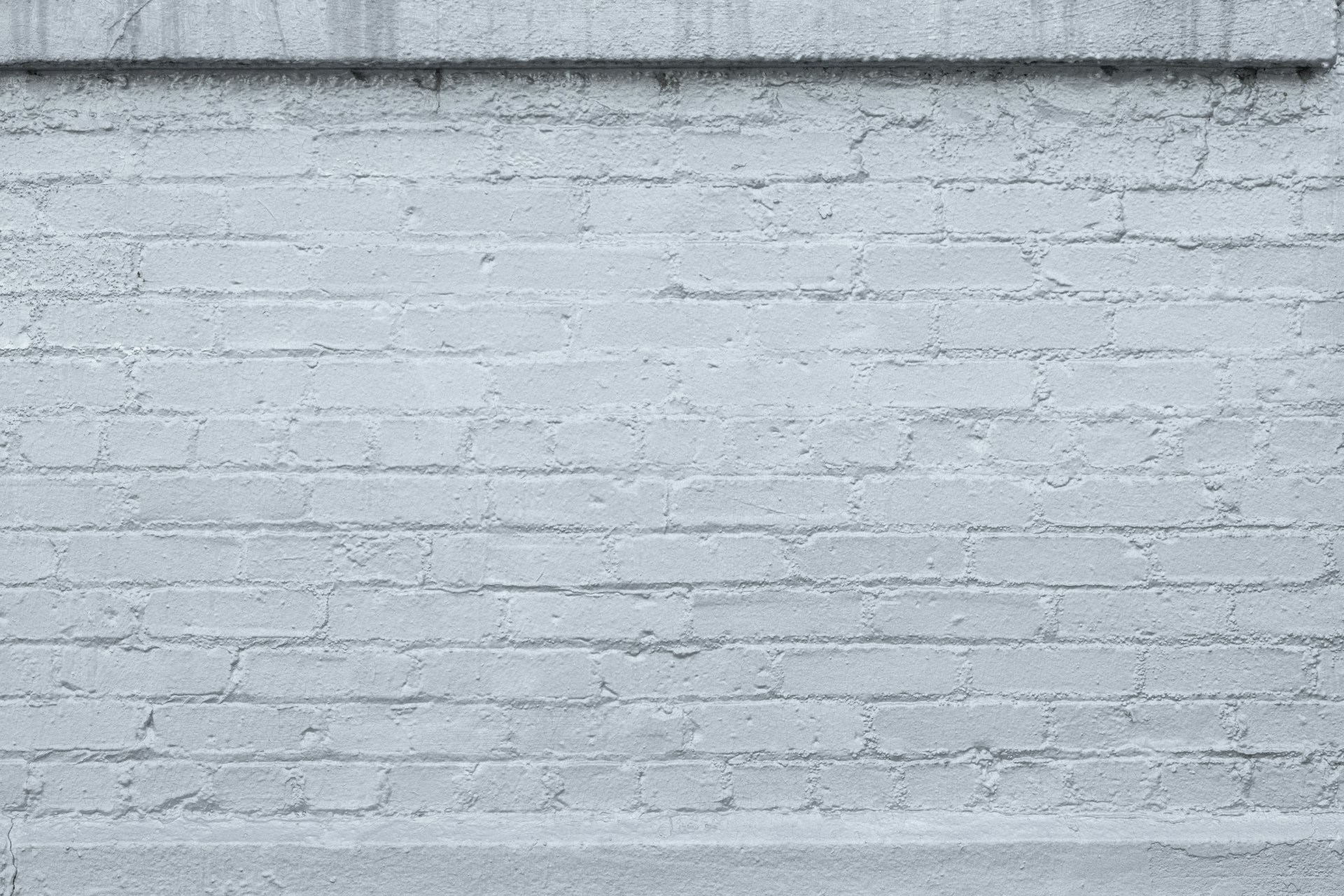 a black and white photo of a brick wall