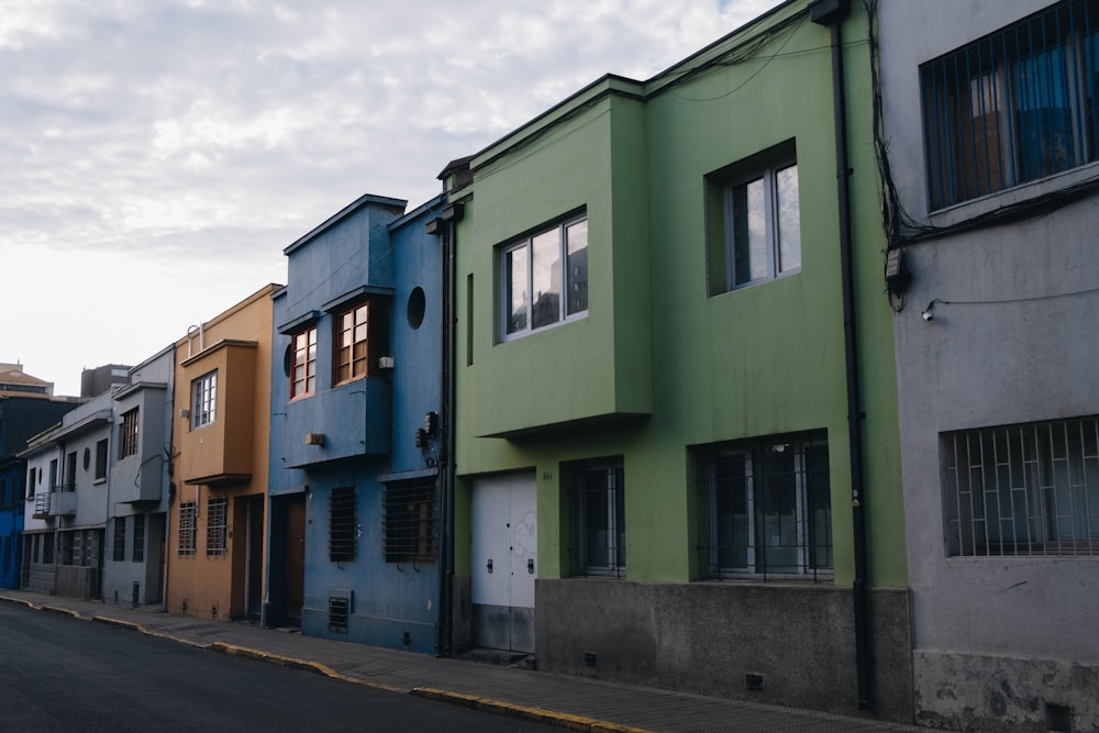 a row of colorful buildings on a street
