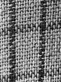a black and white photo of a checkered fabric