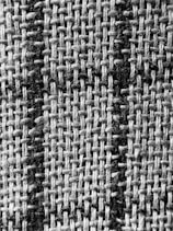 a black and white photo of a checkered fabric