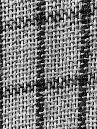 A striped herringbone weave in black and oatmeal, photographed close