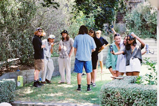 Guests enjoying a lively social gathering on the resort’s spacious lawn.