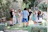 Guests mingling happily on the outdoor patio surrounded by lush greenery at One Ten Venue.