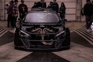 a car with a large engine in a garage