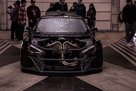 a car with a large engine in a garage