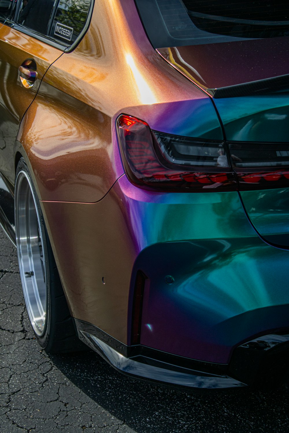 a colorful car parked on the side of the road