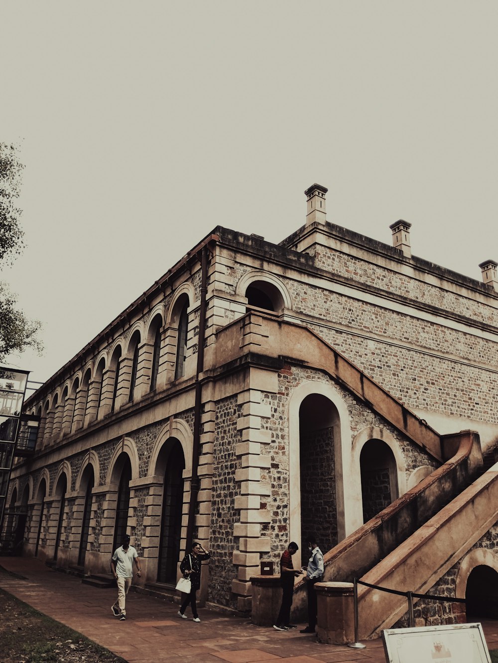 a large brick building with stairs leading up to it