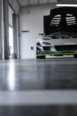 a car parked in a garage with its hood open