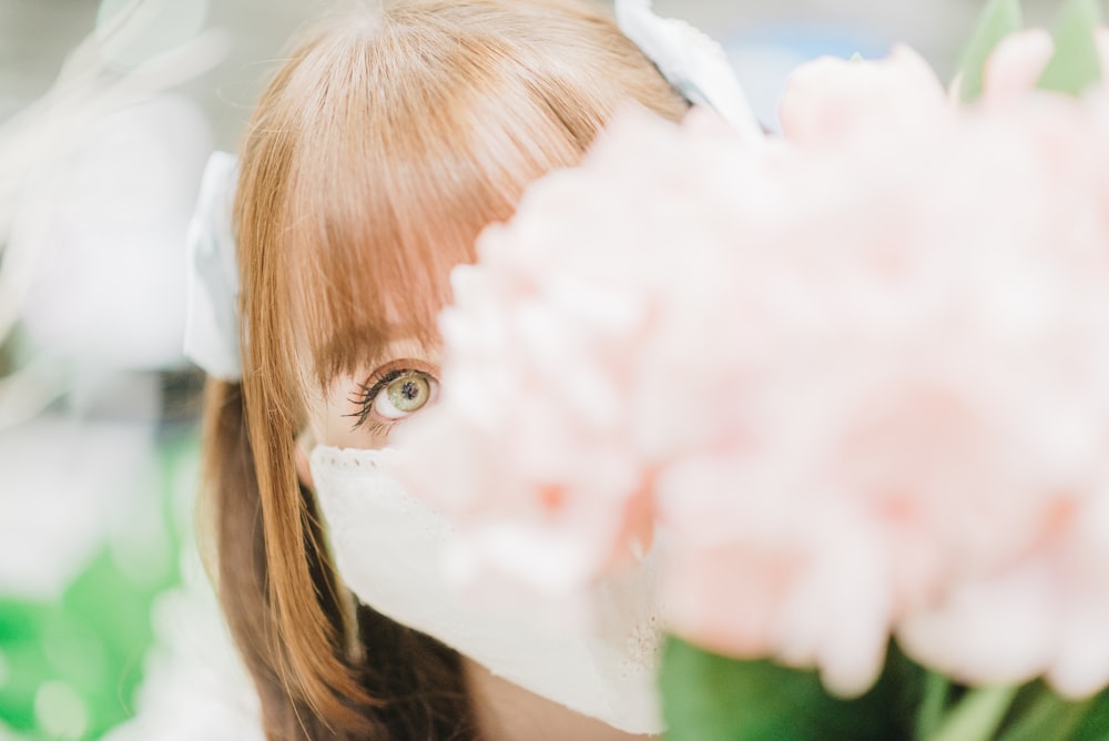 a girl with a flower in her hair