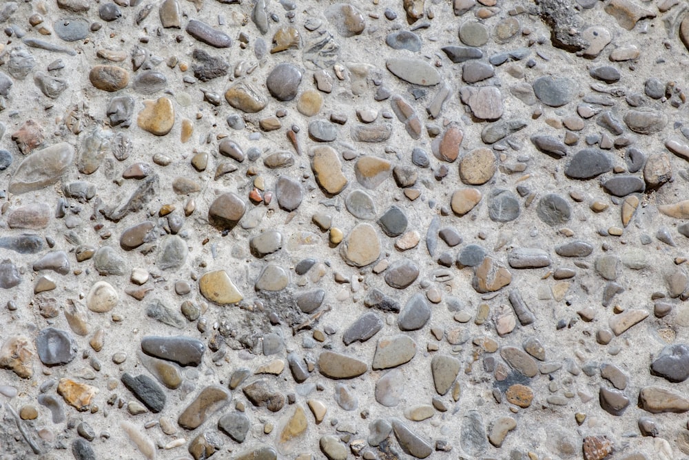 a close up of rocks and gravel on a wall