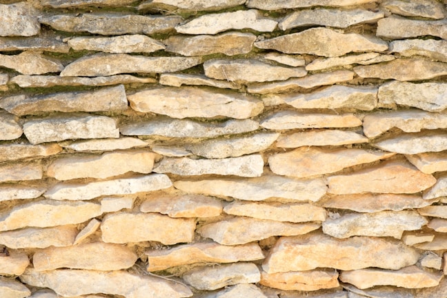 Close-up of a traditional dry stone wall blending with the natural landscape.