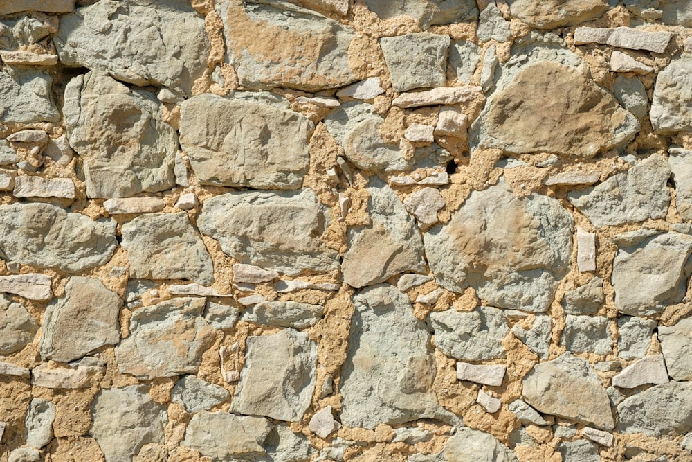 a stone wall made of rocks and cement