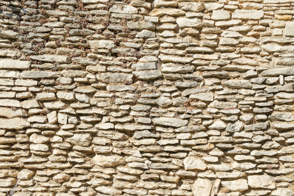 a stone wall made of small rocks