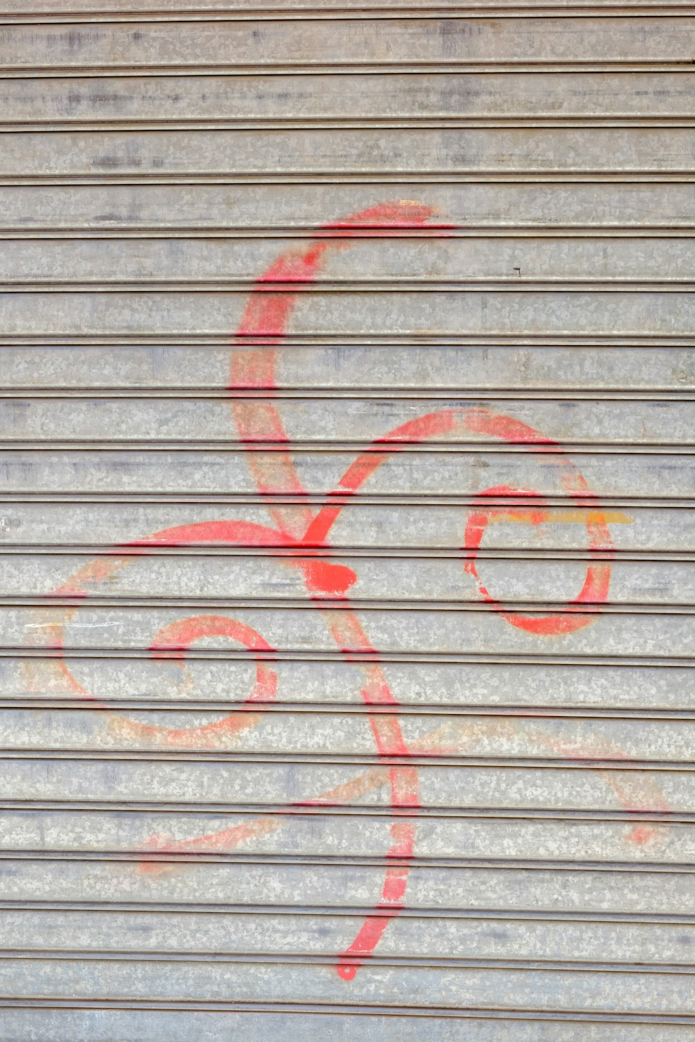 graffiti on a garage door with a red octopus drawn on it