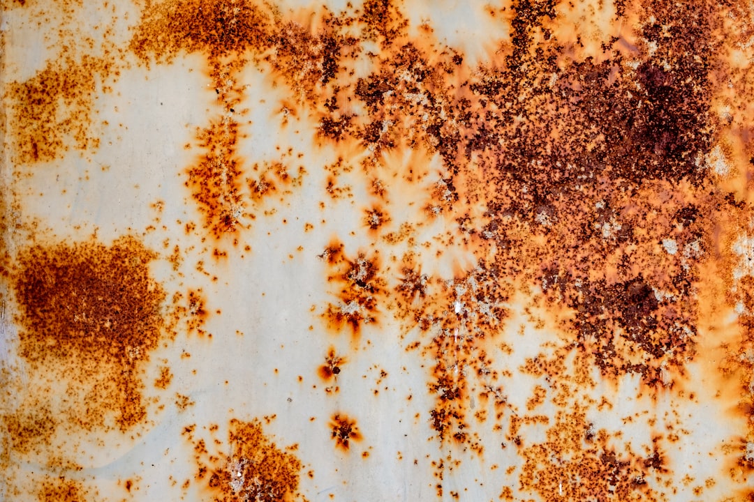 a rusted metal surface with lots of rust on it,
