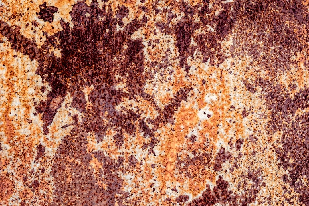 a rusted metal surface with a lot of rust on it,