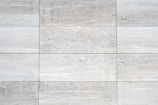 a close up of a white tiled wall