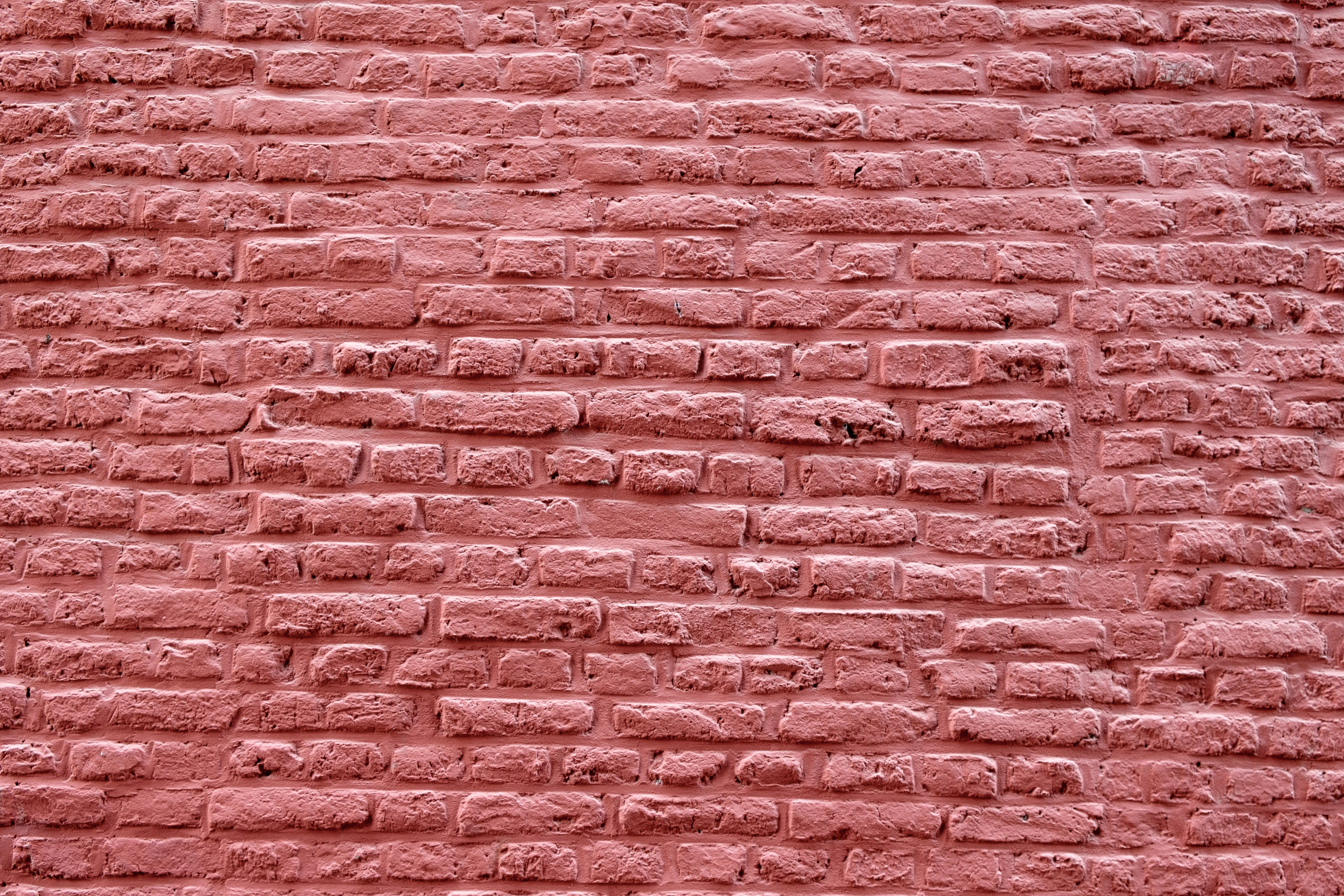 a close up of a red brick wall