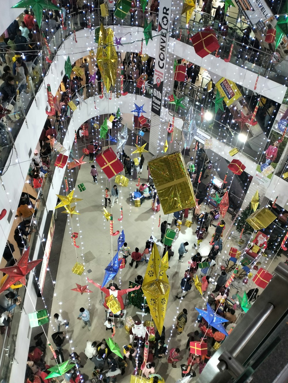 a large group of people standing around a building