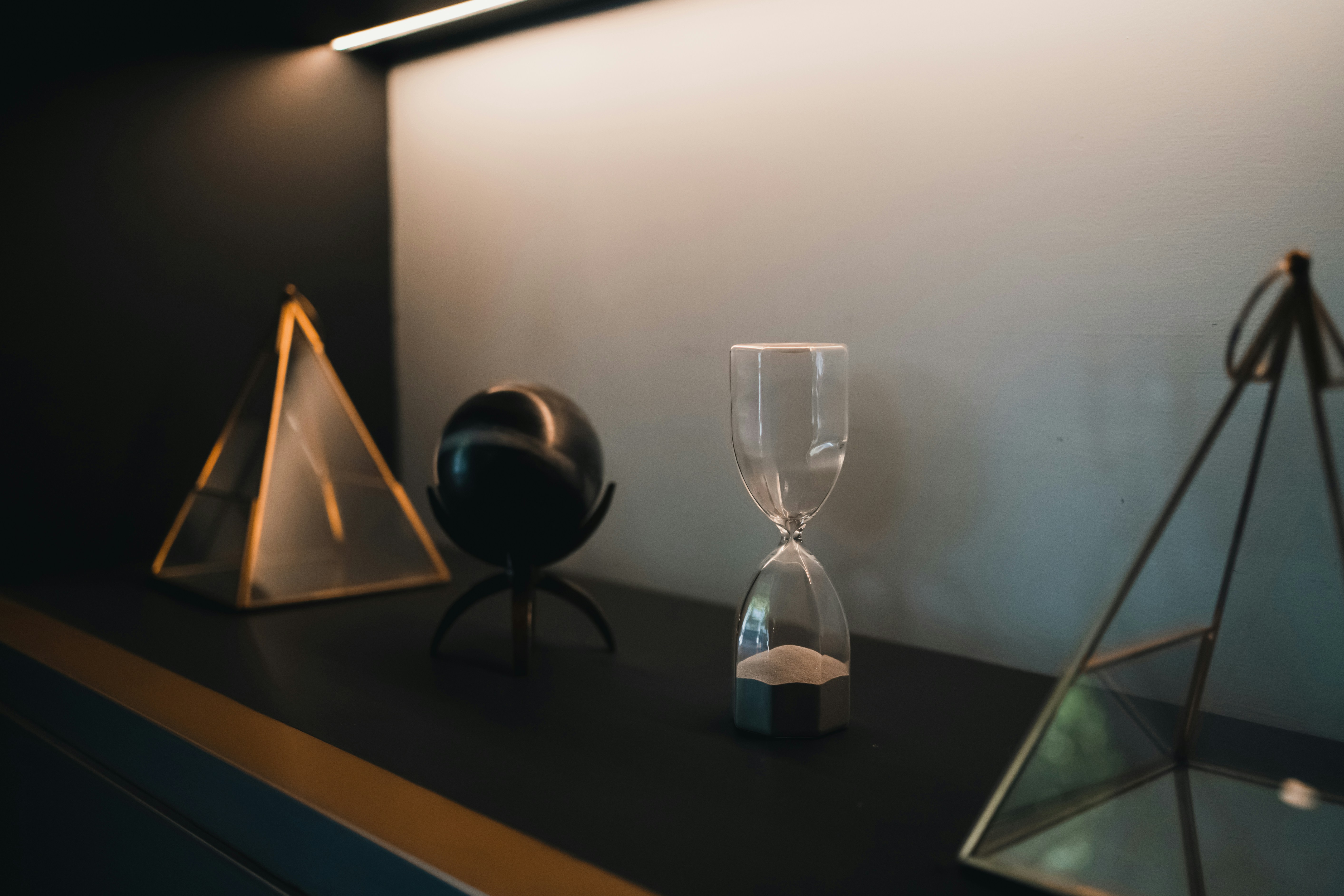 three different types of glass on a shelf