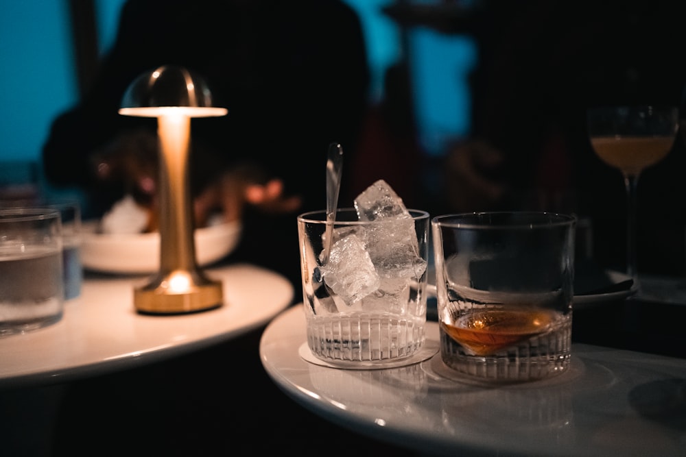 a couple of glasses sitting on top of a table