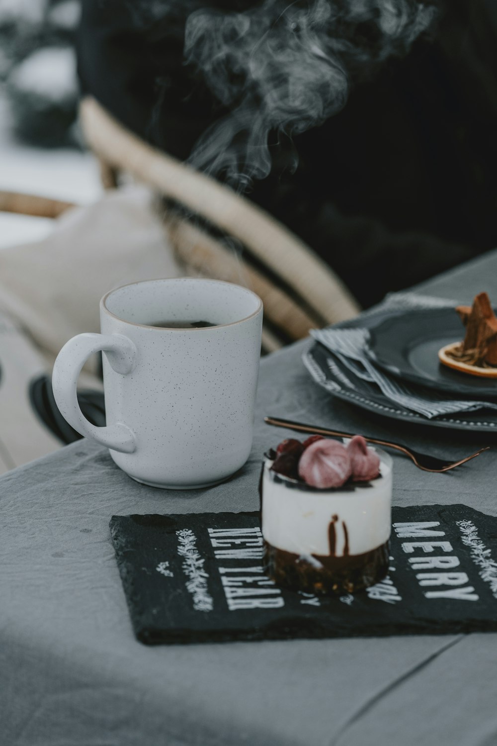 a cup of coffee sitting on top of a table