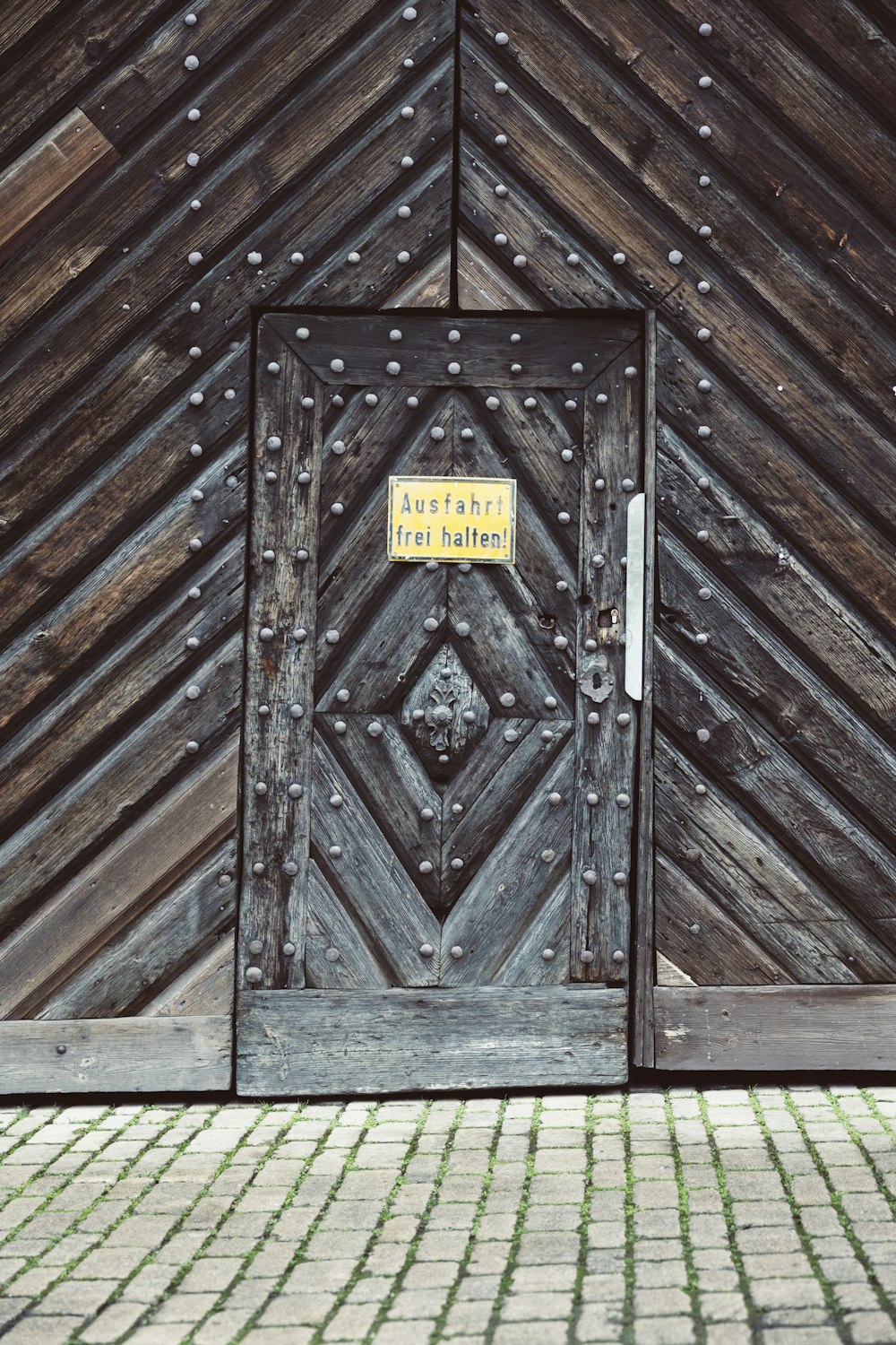 a wooden door with a sign on it