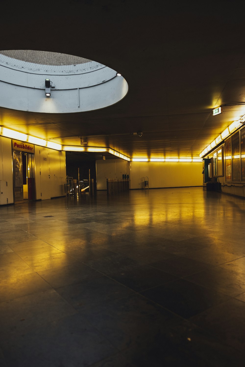 a dimly lit room with a circular ceiling