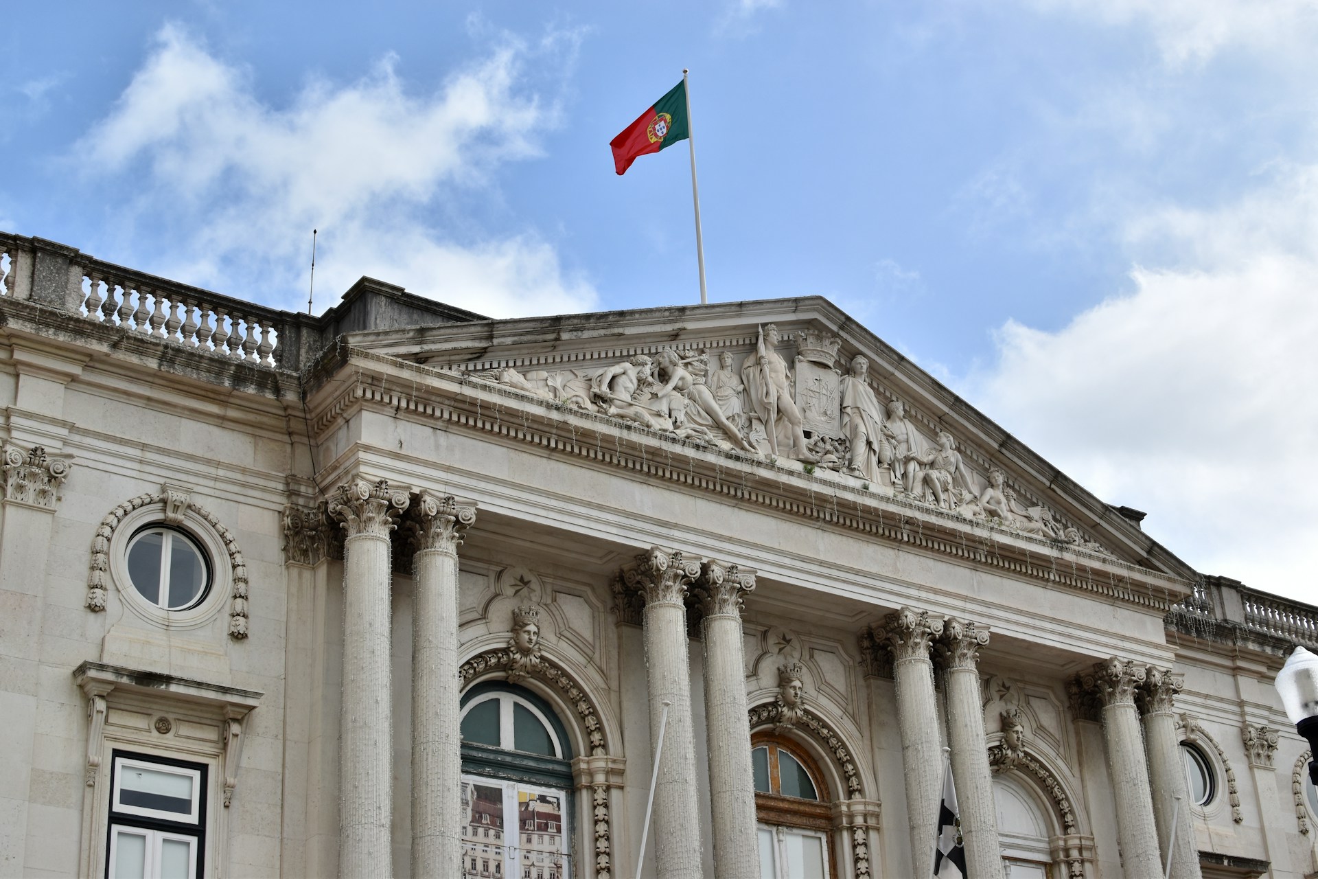 a large white building with a flag on top of it