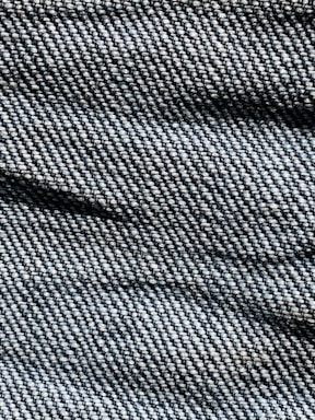 Close-up of elegant denim fabric with soft pastel lighting
