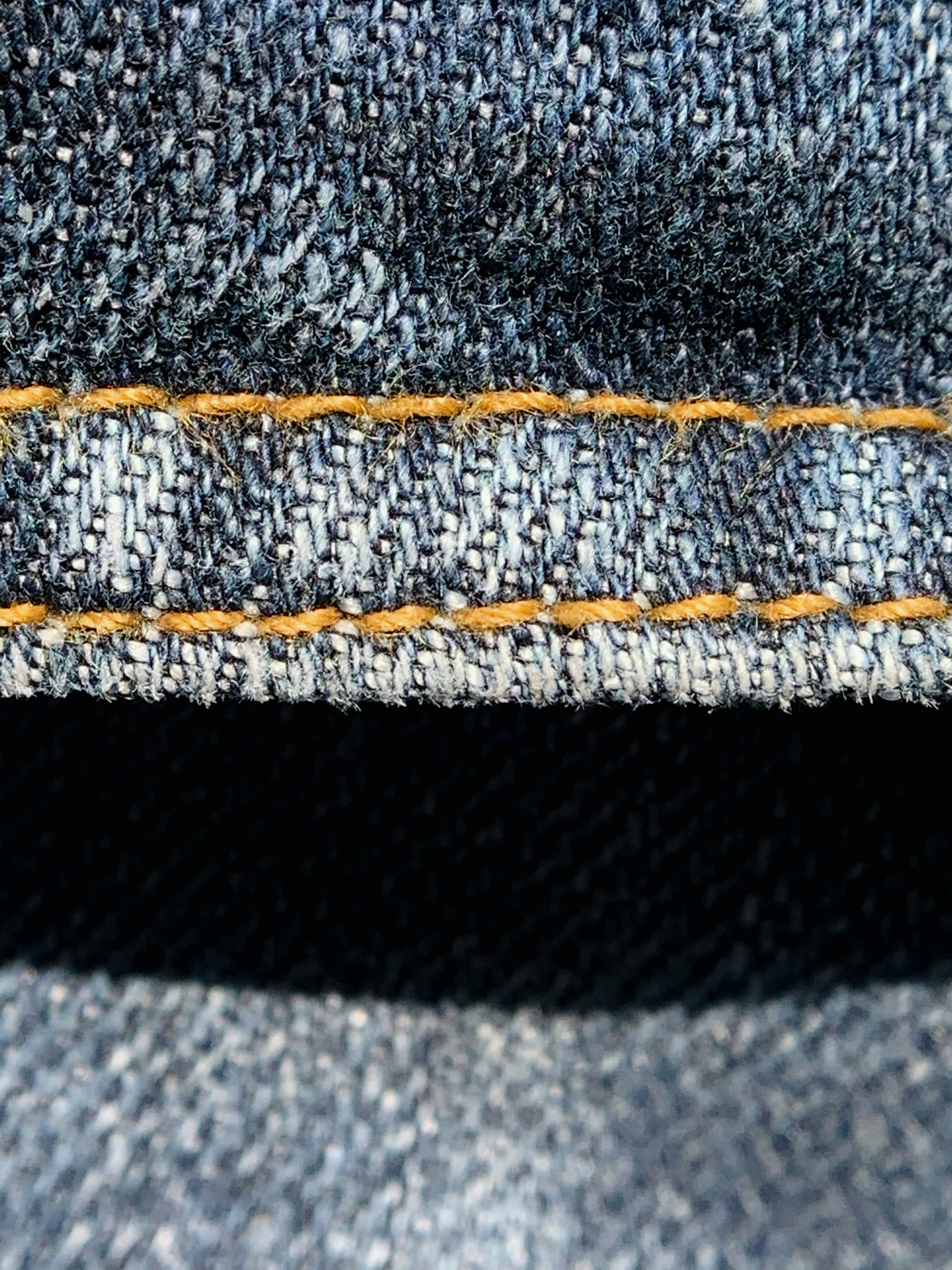 a close up view of a blue jeans pocket