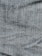 A close-up view of denim fabric with visible blue and white threads intersecting to form a classic twill pattern.