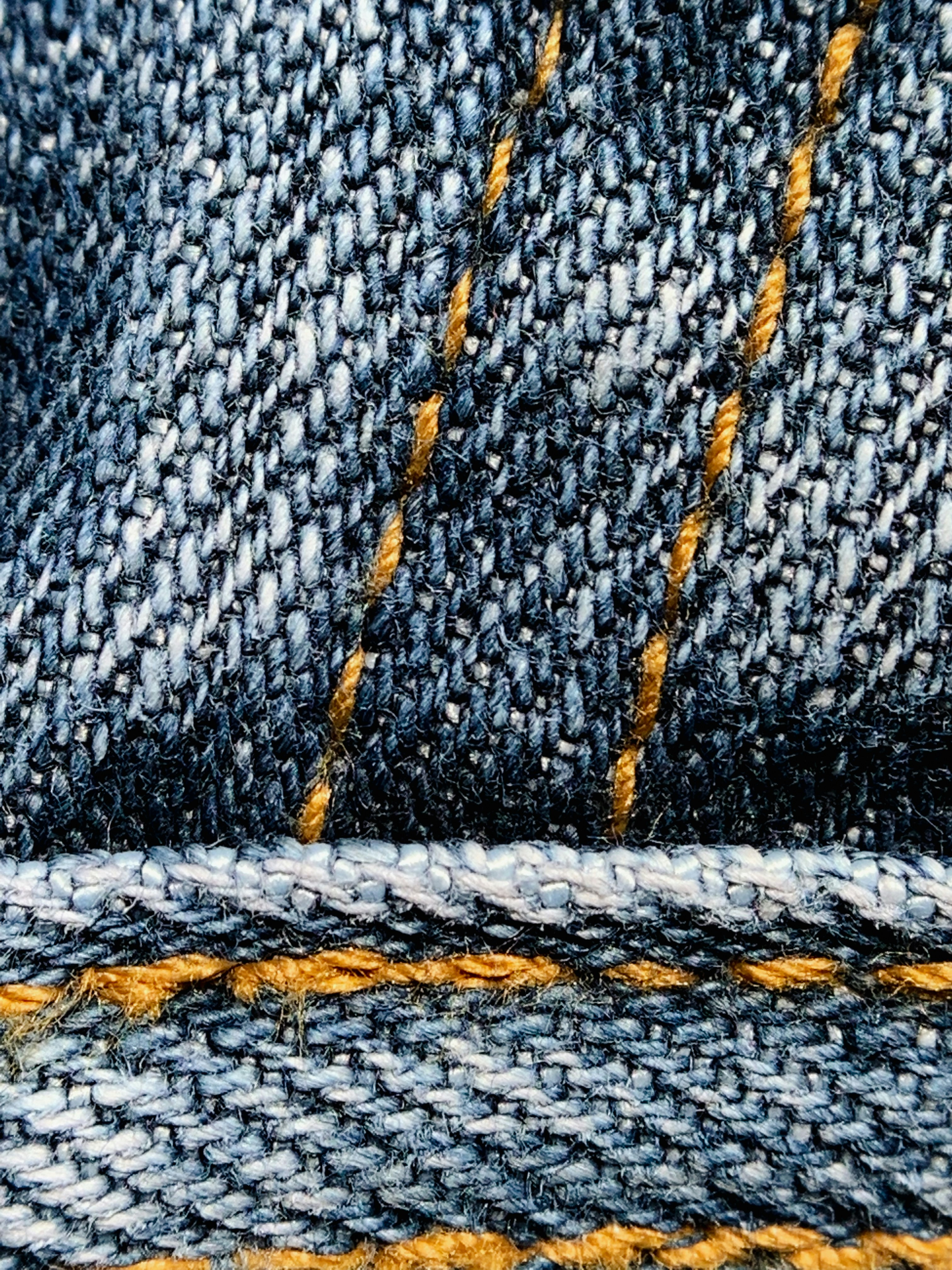 a close up of a blue and yellow striped fabric