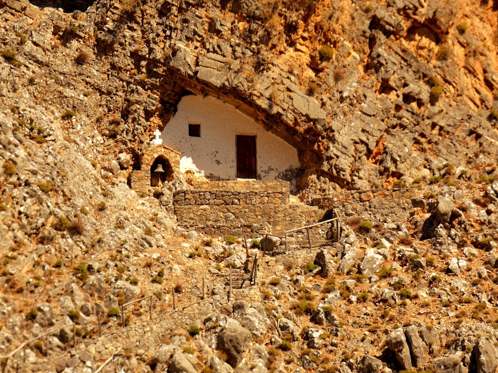 a small house built into the side of a mountain