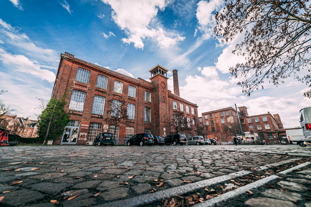 a large brick building sitting on the side of a road