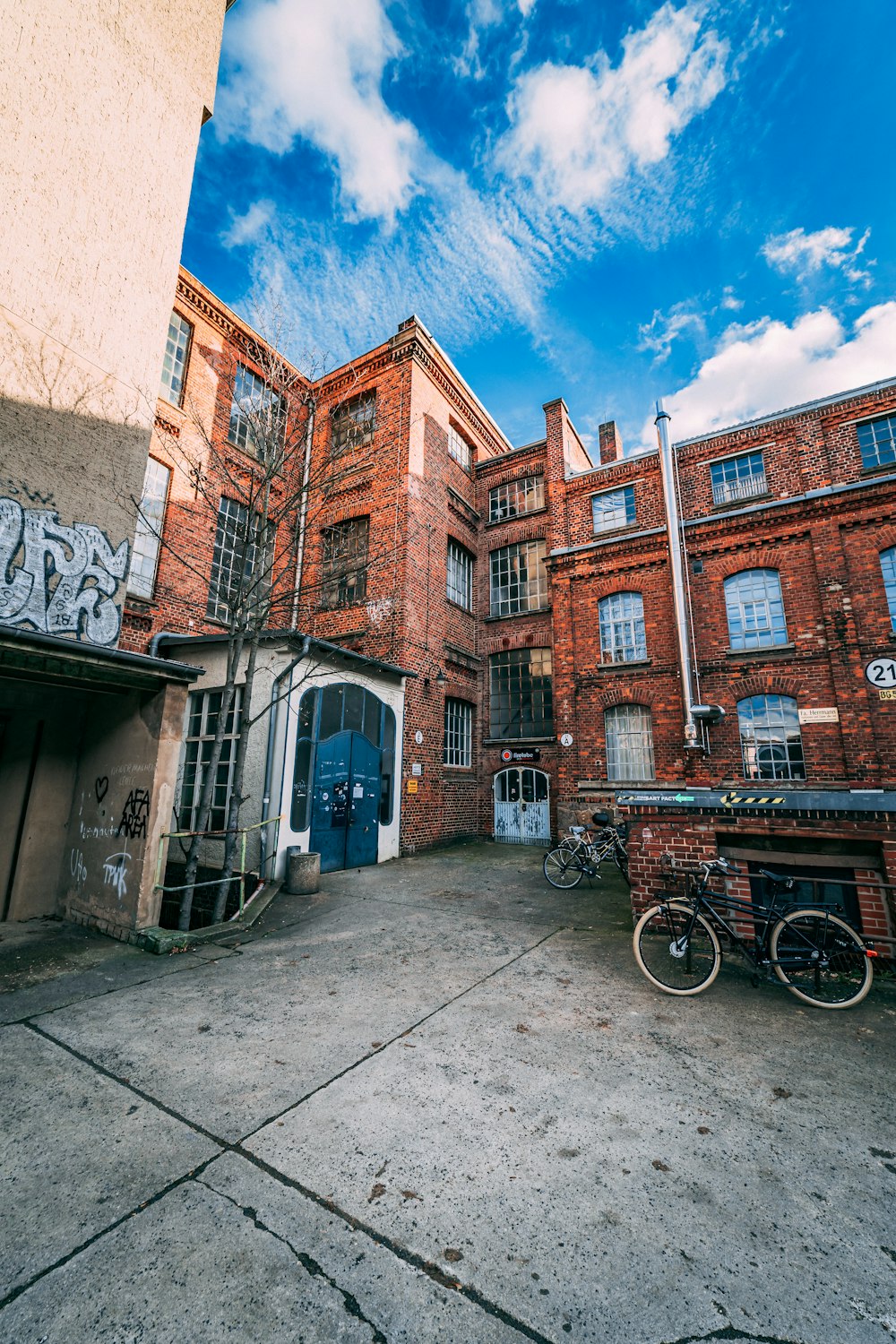 a brick building with graffiti on the side of it