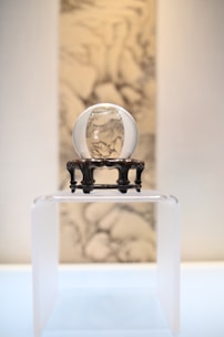 An ethereal crystal ball on a velvet cloth.