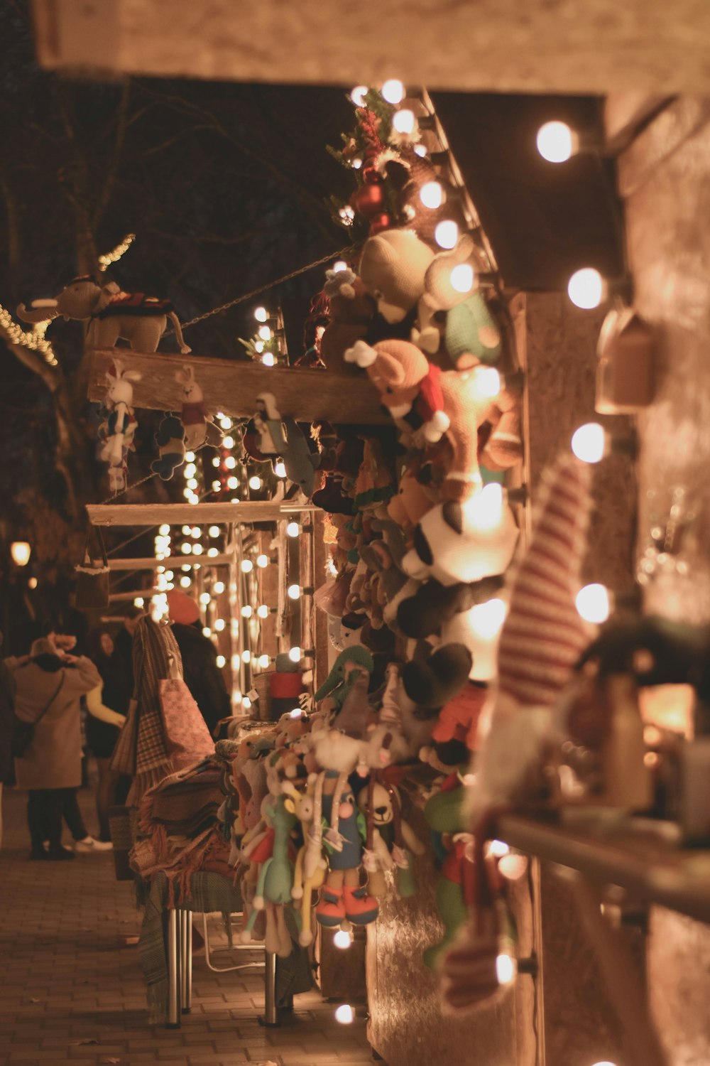 a christmas display with lights and stuffed animals
