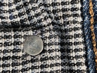 Close-up of uniform fabric samples showing formal and non-formal styles.