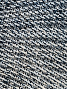 Detailed shot of twill fabric highlighting its diagonal rib pattern.