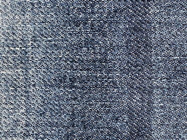 A close-up of high-stretch denim fabric showcasing its flexibility.