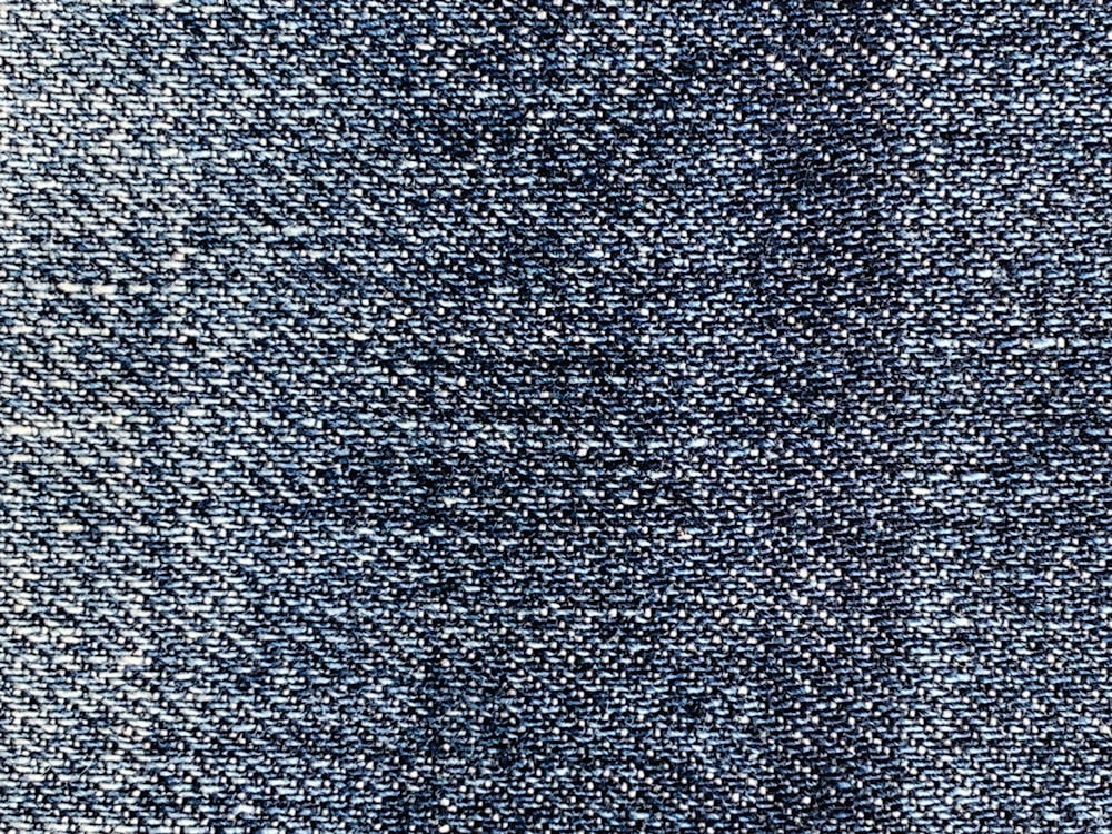 a close up view of a blue denim fabric